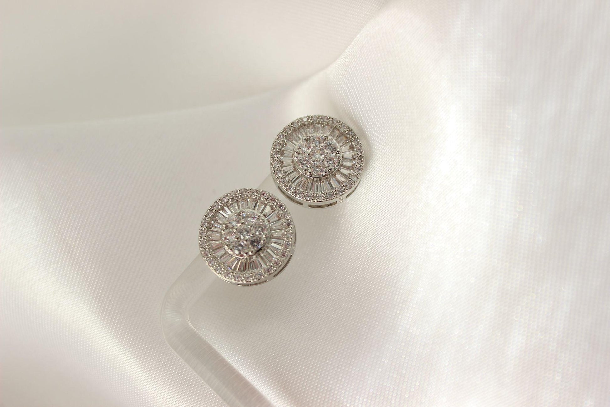 Medium Silver Stud Earrings on white cloth