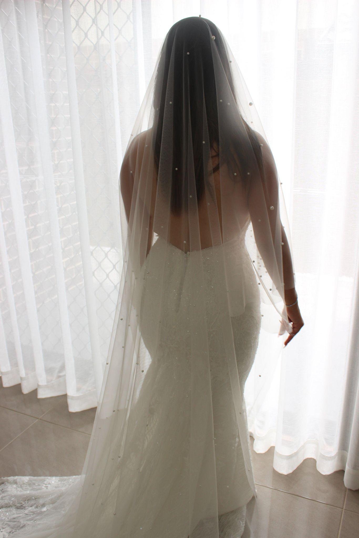Pearl 2 tier champagne bridal veil on bride