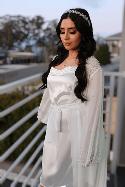 bride wearing Pearl Bridal Slip on balcony