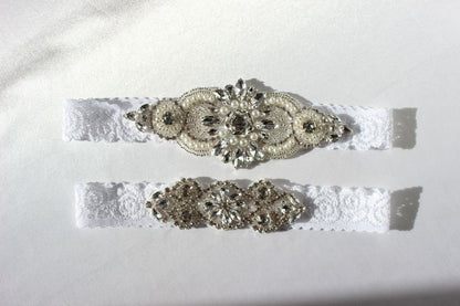 Detailed view of pearl and crystal embellishments on floral lace garter