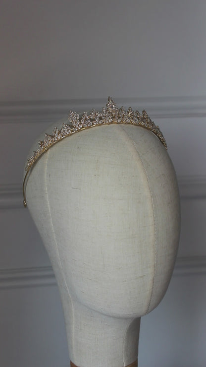 Video of medium gold bridal tiara with cubic zirconia crystals displayed on mannequin