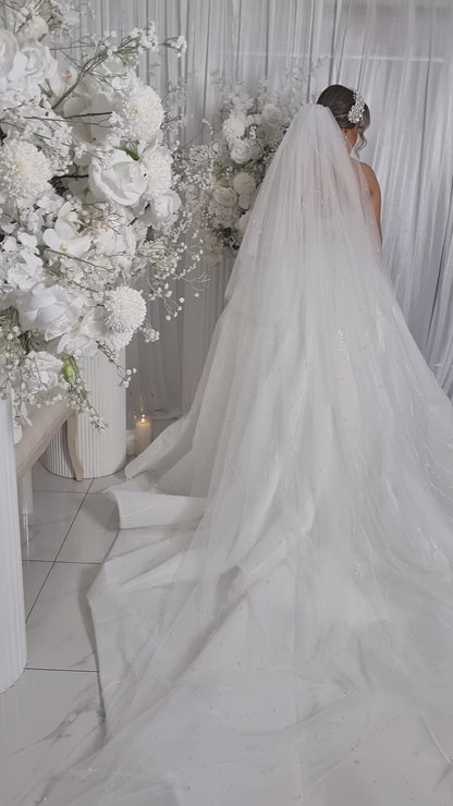 Bride wearing 2 tier pearl veil