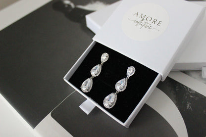 Silver drop earrings with three pear-shaped stones