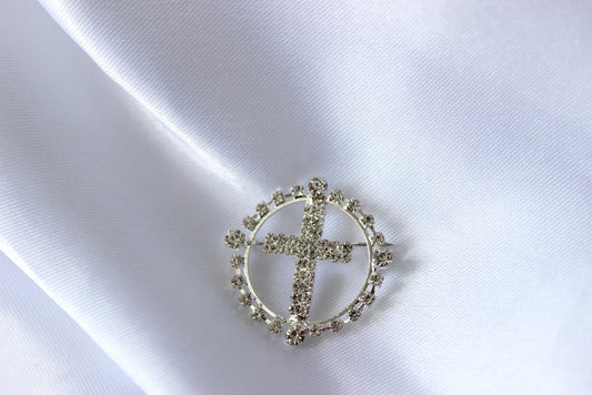 Round Silver Cross Brooch on white cloth