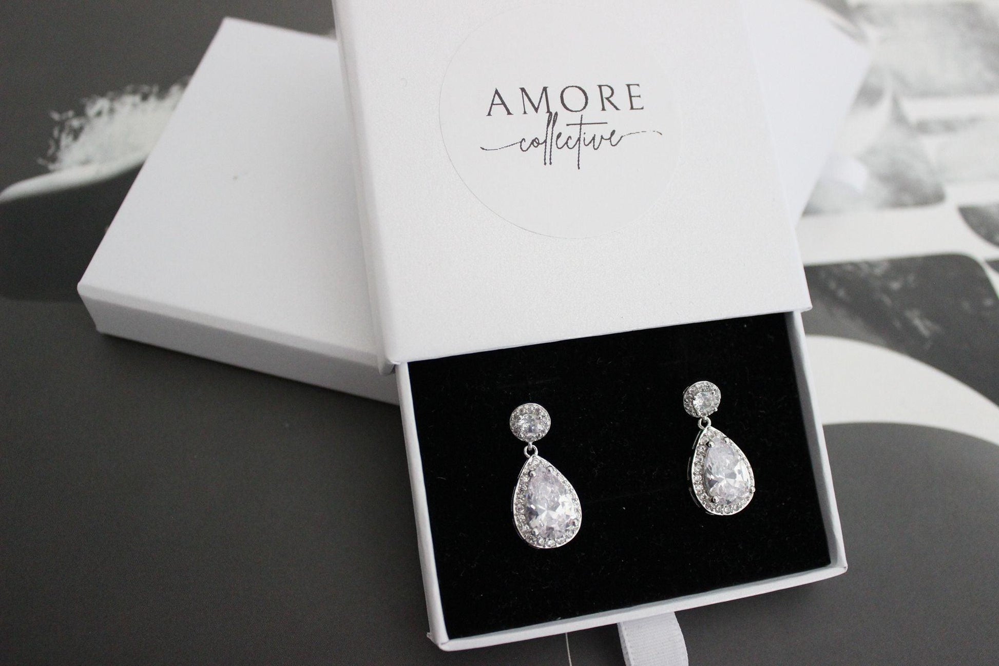 Silver round and pear drop earrings