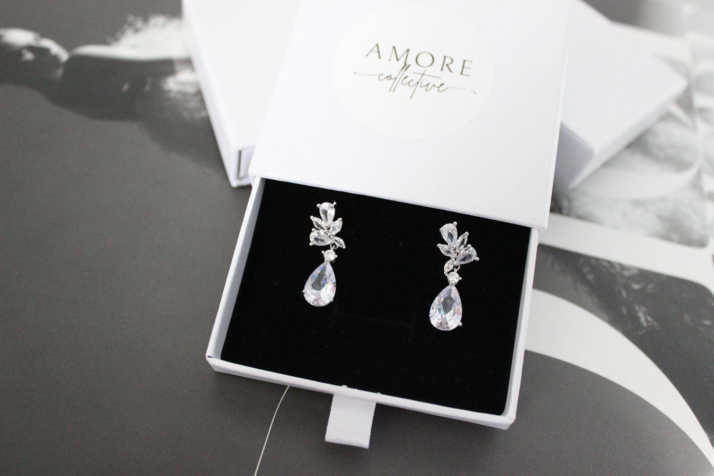 tanesha crystal silver earrings in jewellery box