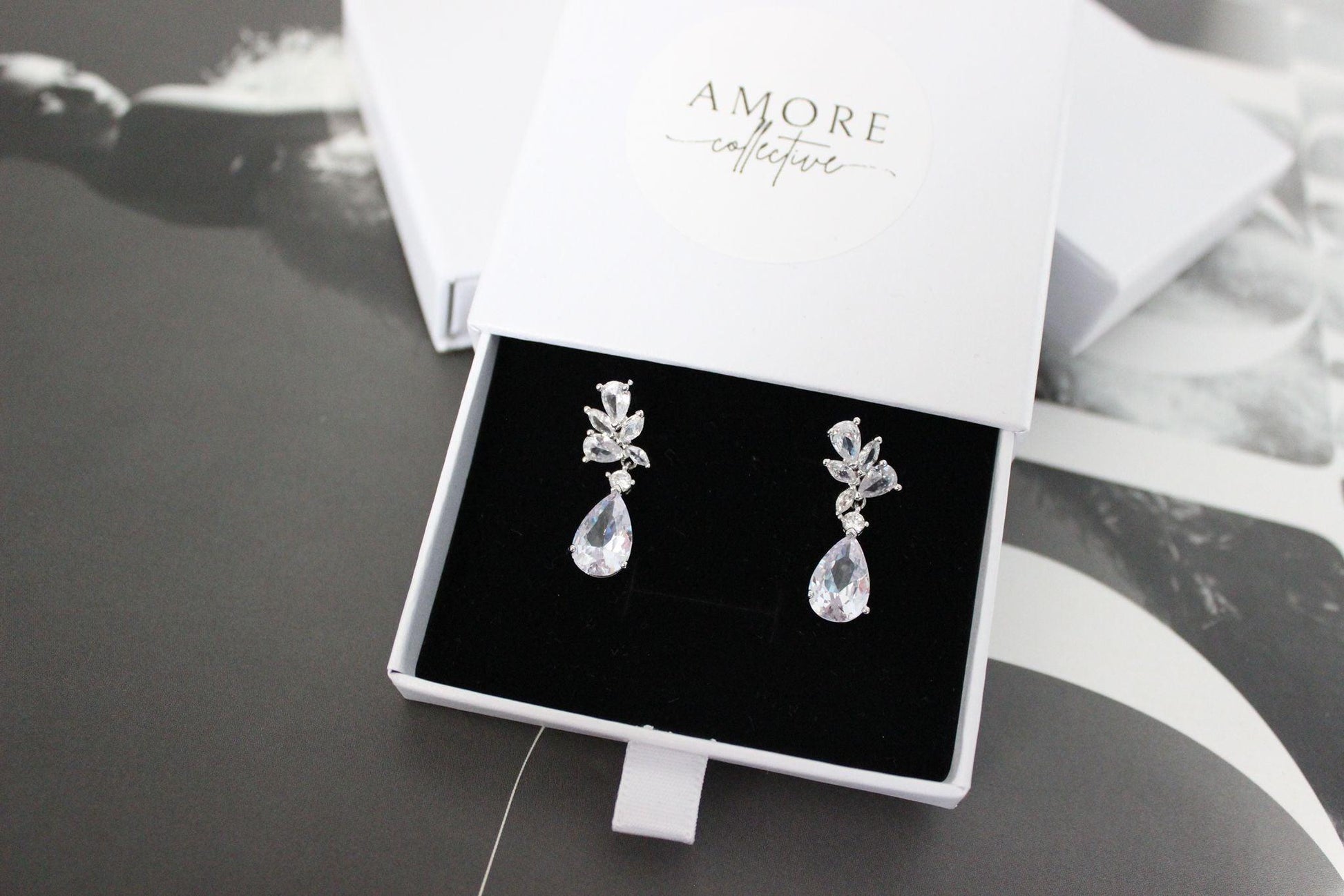 tanesha crystal silver earrings in jewellery box