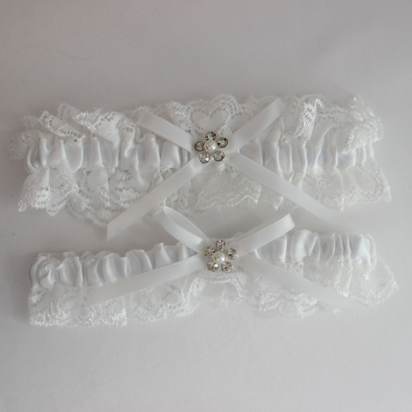Two white lace bridal garters