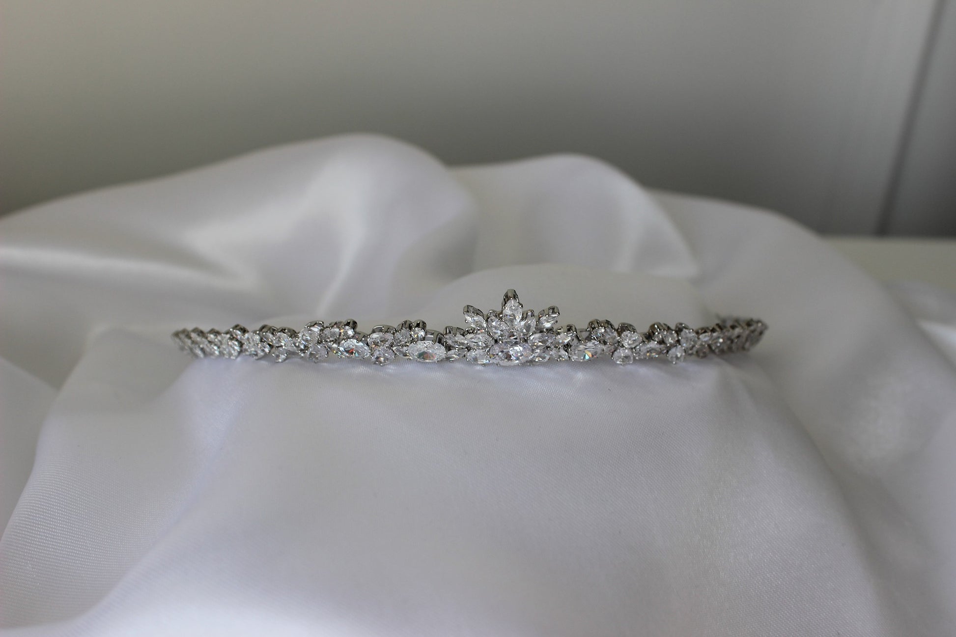 Vivian small silver wedding tiara on white fabric